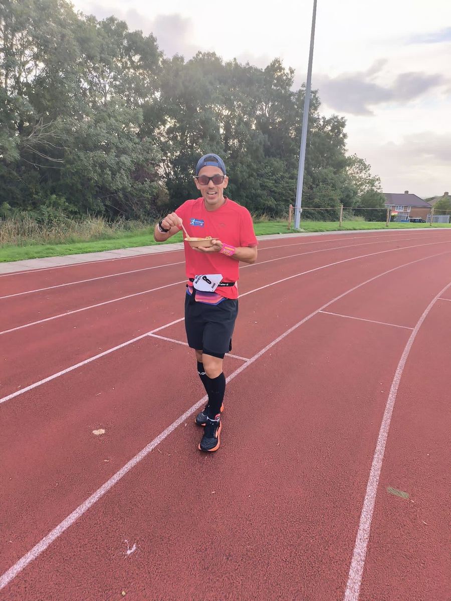 Dominik Erne running alone on the track in the evening light