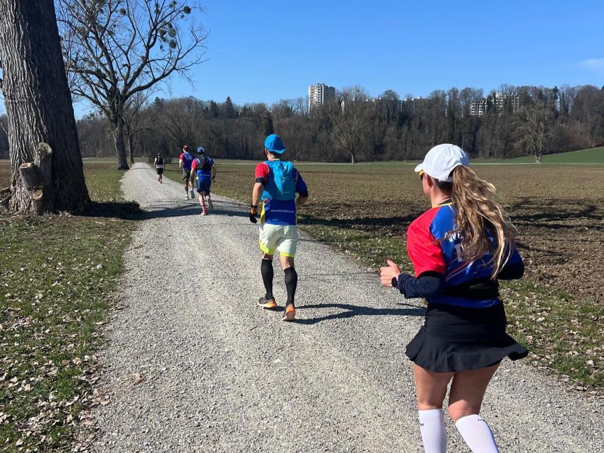 Runners on a gravel path in the countryside