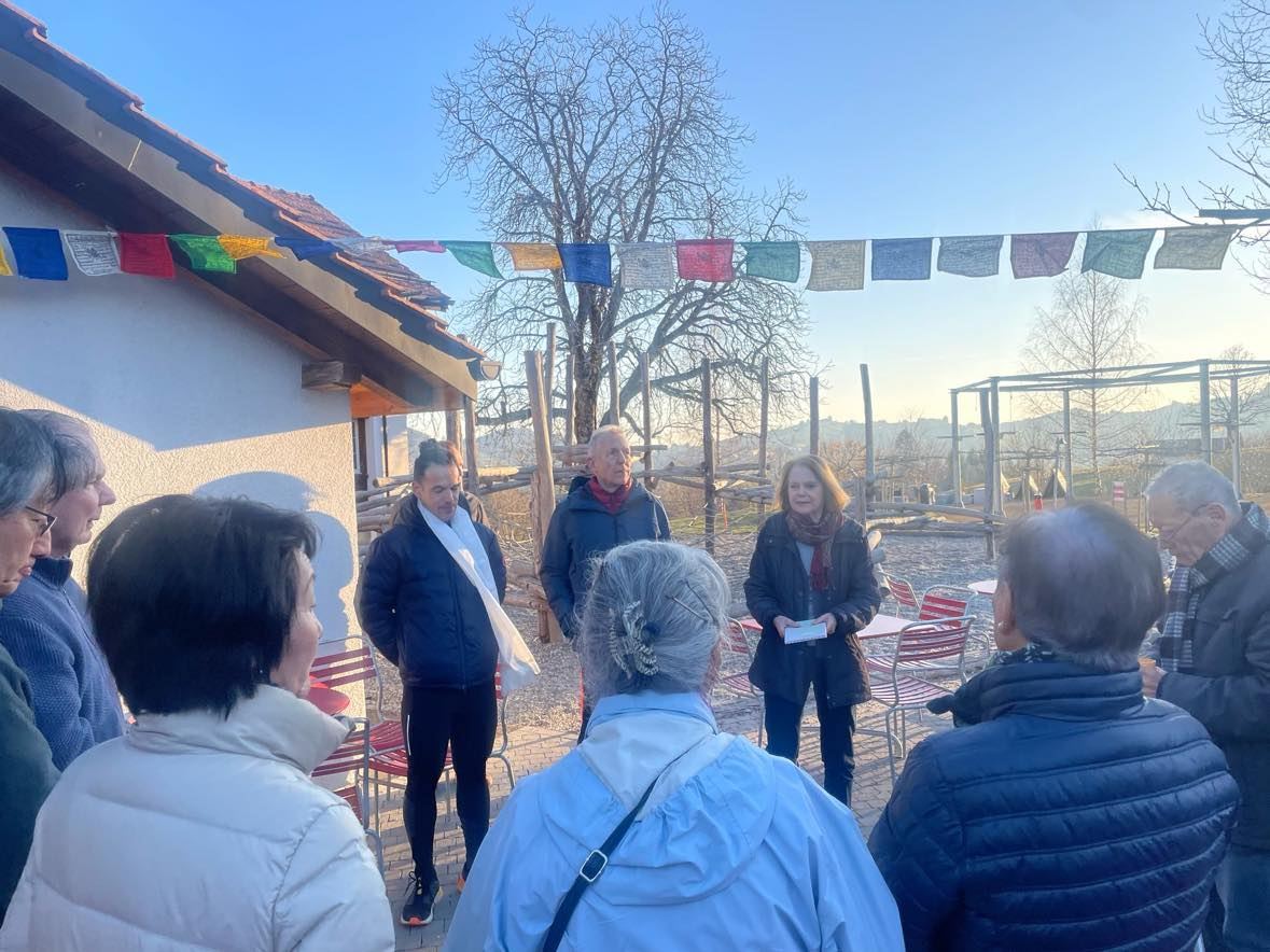 Supporters outside a house with prayer flags in Trogen